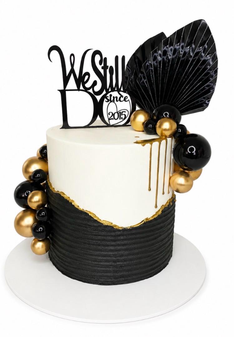 Black and gold celebration cake