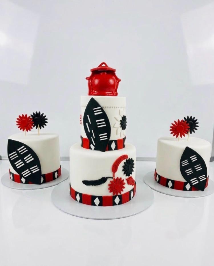 Two-tier wedding cake with traditional sides